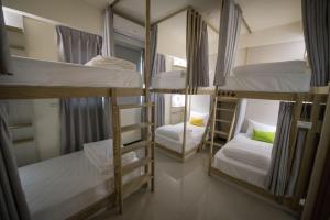 Giường trong phòng chung tại 漫時光 旅空間 ManLu INN