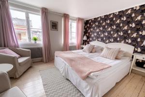 Postel nebo postele na pokoji v ubytování Smålandsgården