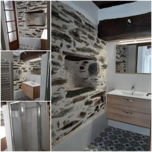a bathroom with a stone wall and a sink at Casa Pernice in Penta-di-Casinca +59 photos