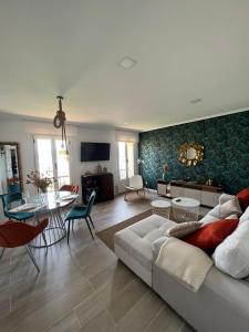 a living room with a couch and a table at Apartamento Entrebateas in Aldán