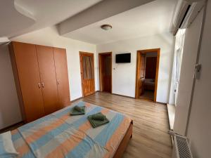 Postel nebo postele na pokoji v ubytování Vila Nei