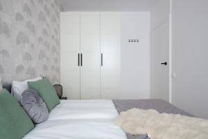 Posteľ alebo postele v izbe v ubytovaní Elite Apartments Stępkarska Premium