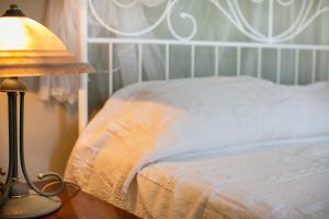 A bed or beds in a room at Al Porticciolo