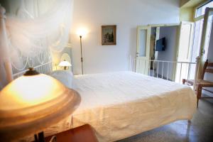 A bed or beds in a room at Al Porticciolo
