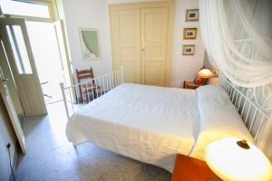 A bed or beds in a room at Al Porticciolo