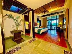 Gallery image of Plumeria Lake Resort & SPA in Shertallai