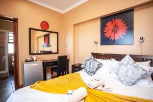 Postel nebo postele na pokoji v ubytování Dolphin Dance Lodge