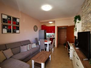 a living room with a couch and a table at Charming and Luxurious Flat with Large Terrace in Herceg-Novi