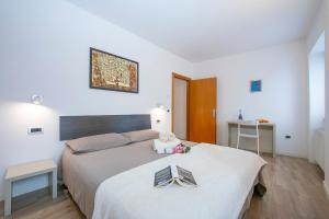 Posteľ alebo postele v izbe v ubytovaní Arco Rocks Apartments