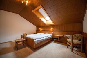 A bed or beds in a room at Apartments Zilli Még 37 kép