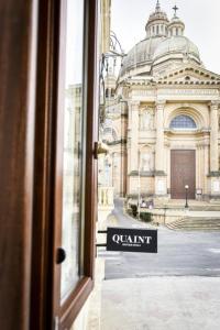 a view from a window of a building with a quarantine sign at Quaint Boutique Hotel Xewkija in Xewkija