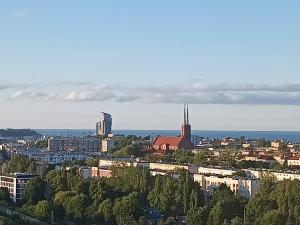 a view of a city with trees and buildings at ORLIK in Gdynia