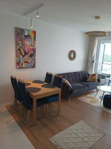a living room with a table and a couch at ORLIK in Gdynia