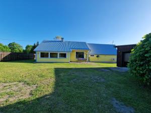 a house with a large yard in front of it at Paju Majutus! in Ohtja