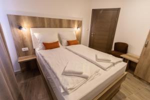 Postel nebo postele na pokoji v ubytování Verdi Rooms