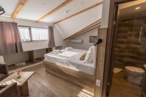 Postel nebo postele na pokoji v ubytování Verdi Rooms