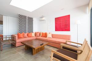 Posezení v ubytování Altos de la Gloria Beach Apartments