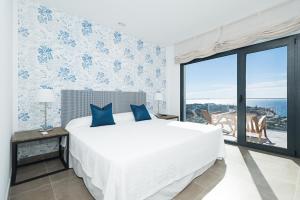 Postel nebo postele na pokoji v ubytování Altos de la Gloria Beach Apartments
