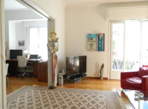 A television and/or entertainment centre at Elegant 3BD apartment in Kolonaki