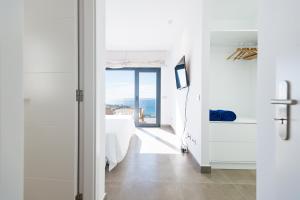Postel nebo postele na pokoji v ubytování Altos de la Gloria Beach Apartments