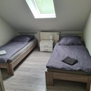 a bedroom with two twin beds and a window at Altstadt Hostel Bremen in Bremen +9 photos