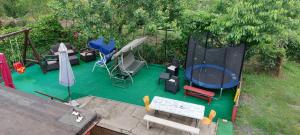 an overhead view of a backyard with furniture and a trampoline at Vila Alexandru in Eforie Nord