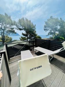 a bench on the roof of a house at Villaggio Smeraldo in Moneglia