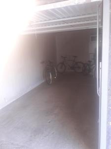 two bikes are parked in a garage at EN VENDEE à saint hilaire de riez DUPLEX 4/6pers in Saint-Hilaire-de-Riez