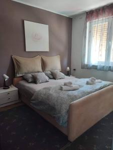 Postel nebo postele na pokoji v ubytování Apartman Joy