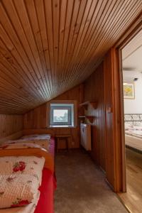 Postel nebo postele na pokoji v ubytování Apartamentai Dana