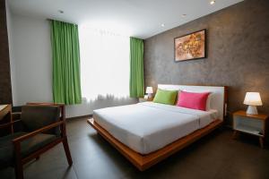 Voodi või voodid majutusasutuse ÊMM Hotel Saigon toas
