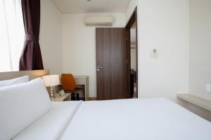 Voodi või voodid majutusasutuse ÊMM Hotel Saigon toas
