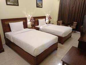 Letto o letti in una camera di ROYAL HOTEL