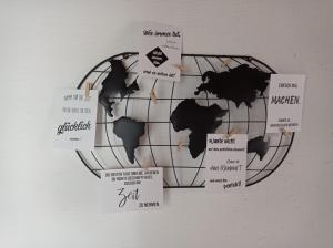 a map of the world on a wall at Ferienwohnung Mohnblume Müddersheim Vettweiß in Vettweiß
