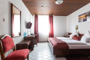 Postel nebo postele na pokoji v ubytování Hotel Weinhaus Wiedemann