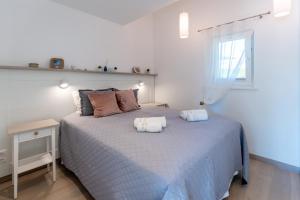 Ένα ή περισσότερα κρεβάτια σε δωμάτιο στο Preilos Perliukas