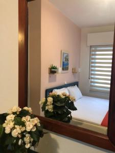 A bed or beds in a room at Plaisir Rooms