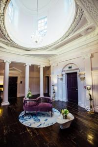 a large room with a couch in the middle of a building at Bellinter House in Navan