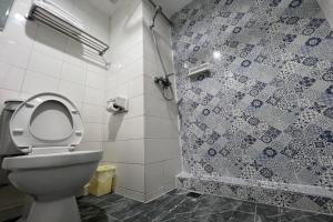a bathroom with a toilet and a shower at Pure Phuket Residence in Phuket +25 photos