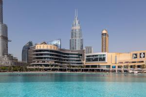 a pool of water in front of a city at Frank Porter - Mon Reve in Dubai