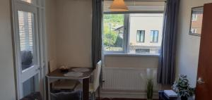 a room with a table and a window at Beautiful Cosy 1Bedroom apartment in London in London