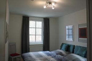 En eller flere senge i et værelse på Haus Meeresblick - Ferienwohnung Kreideküste (Ref. 151261)