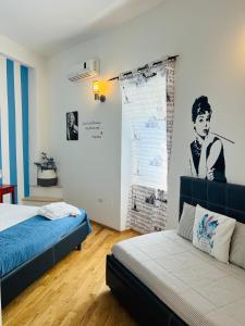 Ένα ή περισσότερα κρεβάτια σε δωμάτιο στο Le Dimore di Federico - Trani