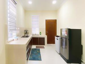 A kitchen or kitchenette at NAZZA Homestay Besut with Swimming Pool