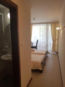 Postel nebo postele na pokoji v ubytování Hotel Klisura