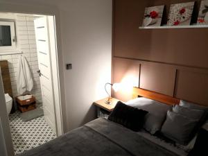Postel nebo postele na pokoji v ubytování Apartmány RŮŽIČKA