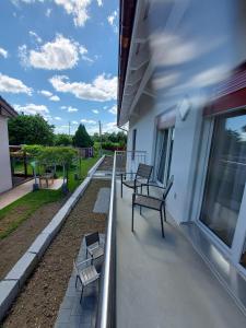 three benches sitting on a balcony of a building at good bed Deitingen in Deitingen