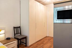 TV a/nebo společenská místnost v ubytování Ferienwohnung Fetscher 2