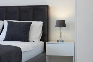 Posteľ alebo postele v izbe v ubytovaní Fratelli apartments