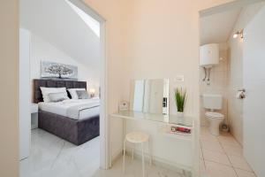 Posteľ alebo postele v izbe v ubytovaní Fratelli apartments